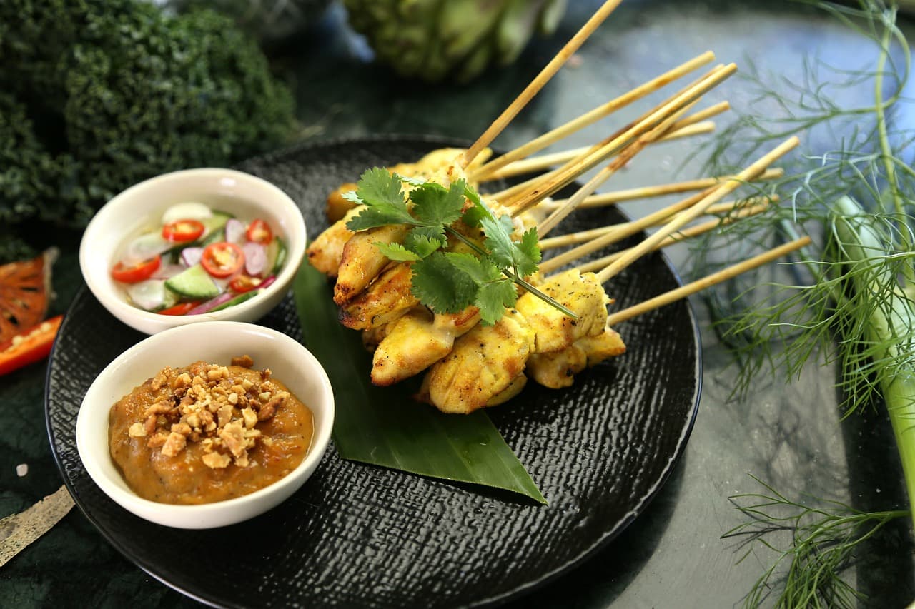 Vibrant Vietnamese dishes and fresh herbs arranged for solo dining